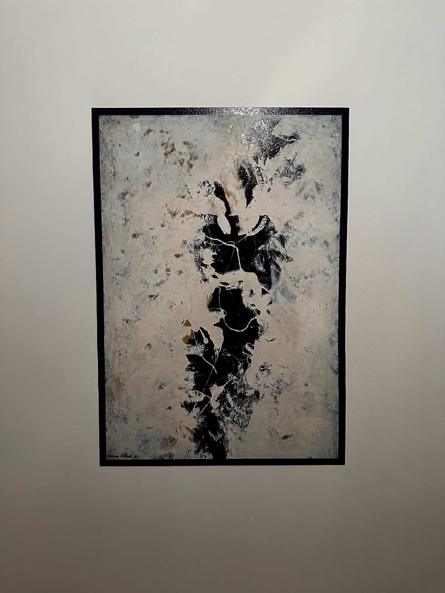 Abstract monochrome artwork printed and framed on a private interior wall.