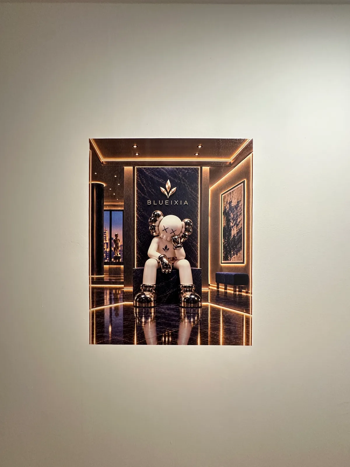 Wall-printed artwork showing the BlueIxia logo and a seated figure in a gold-lit hall.